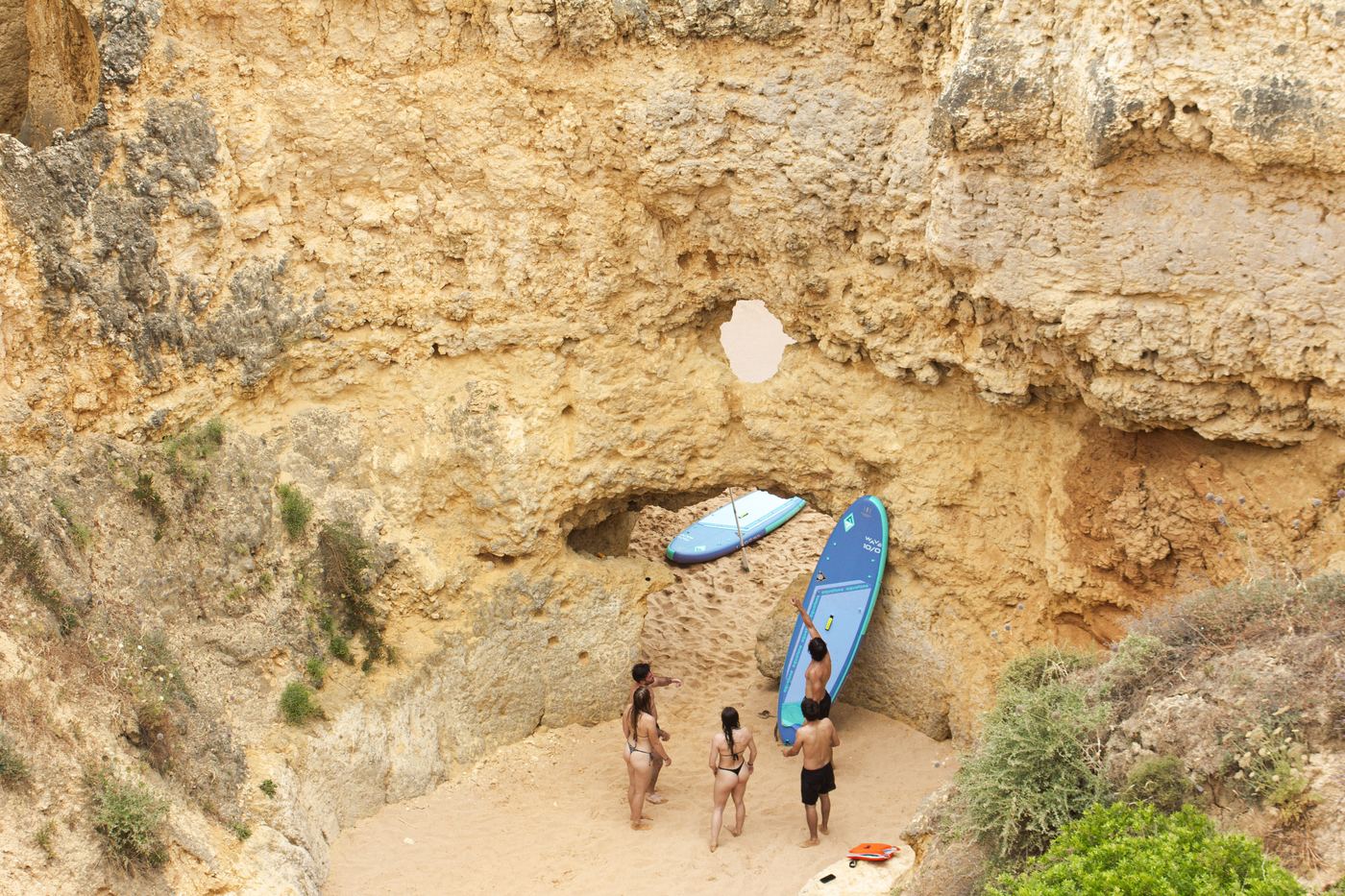 Two paddlers inside Algarve sea cave channel